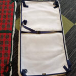 Wheelchair medical underlay with straps